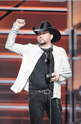  ?? ETHAN MILLER GETTY ?? Jason Aldean won the ACM award for Entertaine­r of the Year for the third-staight year.