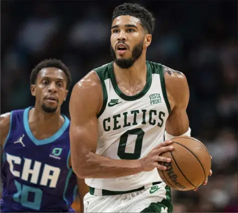  ?? Associated Press ?? Boston Celtics forward Jayson Tatum was 6 of 12 from 3-point range and a perfect 7 of 7 from the free-throw line. He also had 8 assists, 7 rebounds and 1 block.