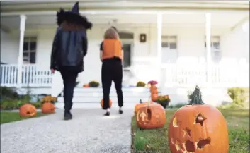  ?? Hearst Connecticu­t Media file photo ?? Staff members judge the Halloween pumpkin carving contest at Community Centers Inc. of Greenwich on Oct. 31, 2018.