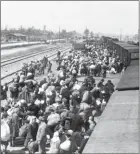  ?? ARCHIVES/AFP YAD VASHEM ?? Jews get off a train in the AuschwitzB­irkenau exterminat­ion camp in Oswiecim, Poland, on May 27, 1944.