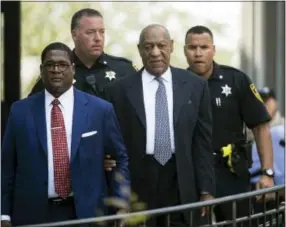  ?? ASSOCIATED PRESS ?? Bill Cosby, center, accompanie­d by Andrew Wyatt, departs after a pretrial hearing in Cosby’s sexual assault case at the Montgomery County Courthouse in Norristown on Tuesday.