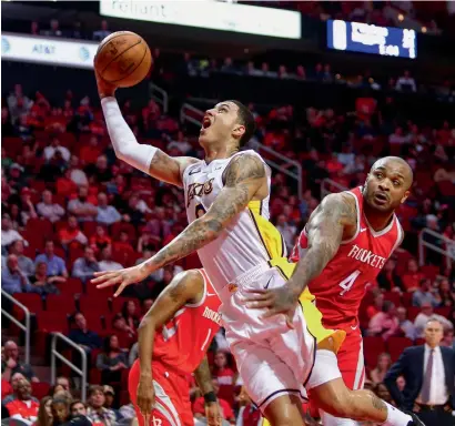  ?? Reuters ?? Lakers’ forward Kyle Kuzma (0) shoots against Rockets’ PJ Tucker (4) during the third quarter against the Houston Rockets. —