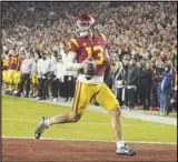  ?? KEVIN REECE Special to the Valley Press ?? USC quarterbac­k Caleb Williams looks back at the Notre Dame defense as he runs in for a touchdown during the first half on Saturday in Los Angeles. USC won 38-27.