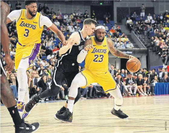  ??  ?? The Lakers’ LeBron James, No.23, in action against the Nets during an exhibition game in Shanghai.