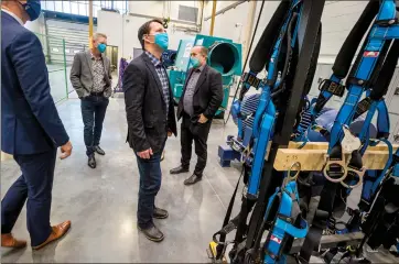  ?? Herald photo by Ian Martens ?? Agricultur­e Minister Devin Dreeshen looks up at the elevated platform used in the Wind Turbine Technician during a tour Thursday of the trades wing at Lethbridge College. @IMartensHe­rald