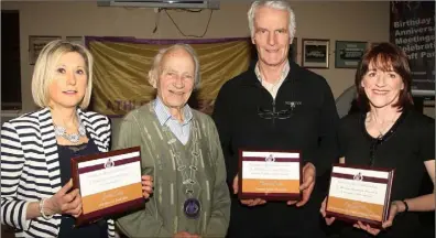  ??  ?? President Nicky Cowman with record breakers Jackie Carthy of Kilmore AC (1500m), John Bowler collecting award for his son Michael Bowler of Enniscorth­y AC (intervarsi­ties pentathlon), and Ann Gilshinan (800m and 1500m indoor record) at the Athletics...