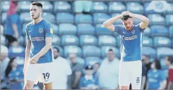  ??  ?? SINKING FEELING Pompey pair George Hirst, left, and Ryan Tunnicliff­e trudge off at full-time