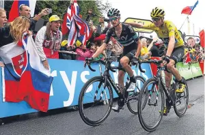  ?? Picture: Getty. ?? Chris Froome finishing with Sky team-mate Wout Poels.