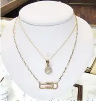  ?? ?? ■ Cooper Fine Jewelers has a wide selection of fine jewelry for that special lady on your list, including the paperclip necklace shown here.