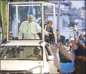  ?? AFP ?? Pope Francis waves to Colombians after arriving in Bogota yesterday.