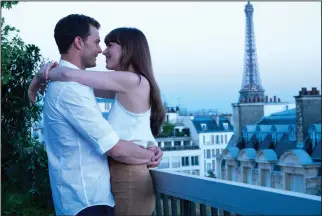  ?? Doane Gregory/Universal Pictures ?? BELOW: Jamie Dornan, left, and Dakota Johnson in “Fifty Shades Freed.” His character considers leaving hers because of her pregnancy.