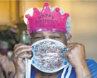  ?? Santiago Mejia / The Chronicle ?? Vicky Blake made festive surgical masks to celebrate her 62nd birthday. Her likely grin can’t be seen behind the mask, but her eyes are smiling in an expressive smize.