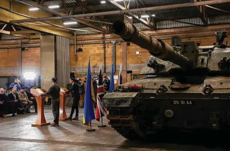  ?? Peter Nicholls/Associated Press ?? British Prime Minister Rishi Sunak and Ukrainian President Volodymyr Zelenskyy appear Wednesday at a news conference at a military facility in Dorset, England. Zelenskyy is seeking additional support for Ukraine in its war against Russia.