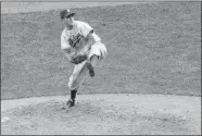  ?? AP PHOTO, FILE ?? Brooklyn Dodgers’ Carl Erskine pitches against the New York Yankees in Game 5 of the baseball World Series in New York on Oct. 5, 1952.