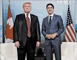  ?? EVAN VUCCI/AP ?? President Trump meets with Canadian Prime Minister Justin Trudeau at the G-7 summit. The two leaders have traded barbs over tariffs Trump imposed on aluminum and steel.