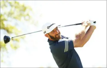  ?? DARREN CARROLL/GETTY IMAGES/AFP ?? Dustin Johnson tees off on the 12th hole during round five of the World Golf Championsh­ips Match-Play at the Austin Country Club in Texas on Saturday.