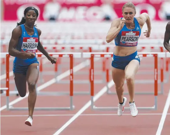  ??  ?? Sally Pearson (right) claims the silver medal behind American Kendra Harrison in the women's 100m hurdles final at the London Diamond League meet.