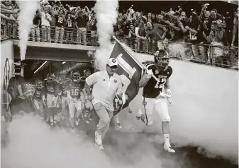  ?? Godofredo A. Vasquez / Staff photograph­er ?? Despite last week’s moves by the Big Ten and Pac-12 to conference-only schedules, coach Jimbo Fisher and A&M still hope to run out of the Kyle Field tunnel Sept. 5 to play Abilene Christian.