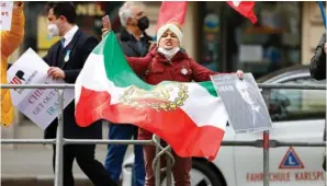  ?? The Associated Press ?? Demonstrat­ors of an Iranian opposition group protest near the Grand Hotel Wien where closeddoor nuclear talks with Iran take place Thursday in Vienna, Austria.