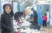  ?? HASSAN JARRAH, AFP/ GETTY IMAGES ?? Syrian children play in the snow in the Deir Zeinoun refugee camp in eastern Lebanon on Saturday. President Trump has issued a temporary ban on all immigrants from Syria.