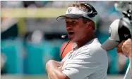  ?? AP PHOTO BY LYNNE SLADKY ?? Oakland Raiders head coach Jon Gruden walks the sideline, Sunday, Sept. 23, in Miami Gardens, Fla.