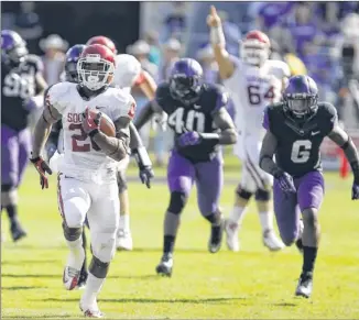  ?? BRANDON WADE / FORT WORTH STAR-TELEGRAM ?? Oklahoma running back Damien Williams, scoring against TCU in the Sooners’ 24-17 win on Saturday, will get a chance to go against Texas A&M in the Cotton Bowl on Jan. 4.