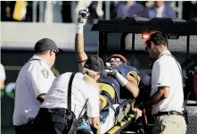  ?? Eric Risberg / Associated Press ?? Cal wide receiver Trevor Davis gives a thumbs-up while being carted off the field following an injury in the fourth quarter.