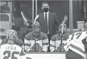  ?? KYLE ROBERTSON/COLUMBUS DISPATCH ?? Ohio State mem's hockey coach Steve Rohlik has kept a positive attitude despite a roller-coaster ride of a season that has seen more dips than thrills.