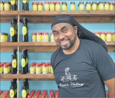  ?? TANIA BARRICKLO — DAILY FREEMAN ?? Richard ‘Ram’ Rajkumar stands in front of some of the products inside his new store, Ram’s Valley Outpost, at 45 North Front St. in Uptown Kingston, N.Y., on Friday.