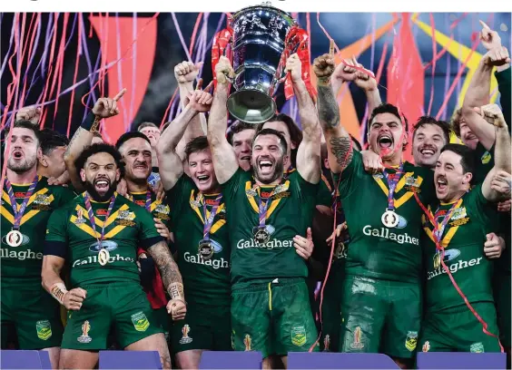  ?? Photo / Photosport ?? The Kangaroos celebrated their third consecutiv­e World Cup triumph after beating Samoa in yesterday’s final.
