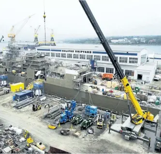  ?? THE CANADIAN PRESS FILES ?? A Navy ship undergoes a mid-life refit at the Irving Shipbuildi­ng facility in Halifax on July 3, 2014.