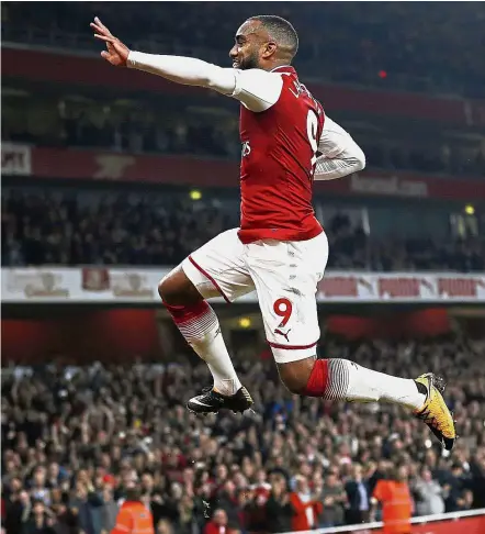  ??  ?? Double hero: Arsenal striker Alexandre Lacazette celebratin­g his first goal against West Bromwich Albion during the English Premier League match at the Emirates on Monday. Lacazette scored both the goals in the 2- 0 win. — AFP