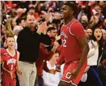  ?? Emilee Chinn / Getty Images ?? Ohio State’s E.J. Liddell celebrates after a basket in the second half as the Buckeyes defeated No. 1 Duke in Columbus, Ohio.