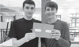  ?? TYLER GUERKE ?? Tyler Guerke, right, and Alec Behan pose for a photo during a Best Buddies meeting at Howard High School. Guerke, a senior on the Lions’ boys lacrosse team, and Behan, who has autism, have been paired together for the last four years.