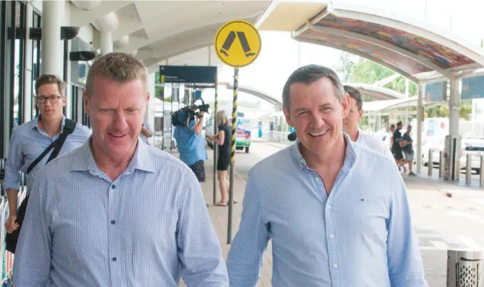  ?? Picture: GENN CAMPBELL ?? Chief Minister Michael Gunner is greeted by Paul Kirby MLA as he arrives at Darwin Airport after sacking three Labor members of parliament from Caucus