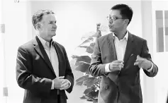  ??  ?? Photo shows Veihmeyer (left) and Johan are seen conversing. Disruption has become a fact of life for CEOs and their businesses as they respond to heightened uncertaint­ies, says Veihmeyer.