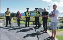  ?? 01_B35police0­2 ?? and below, The Outdoor Centre meeting adjourns outside to the veranda overlookin­g Holy Isle.