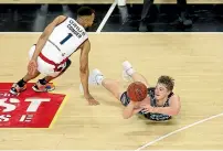  ?? GETTY IMAGES ?? Finn Delany of the Breakers dives for a loose ball against Demitrius Conger of the 36ers during their ANBL in Auckland.