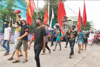  ?? Dawei Watch / AFP / Getty Images ?? Coup opponents join a rally in Dawei against the military junta that seized power. Deadly confrontat­ions between the military and ethnic minority groups have increased in recent months.