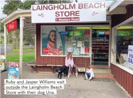  ?? ?? Ruby and Jasper Williams wait outside the Laingholm Beach Store with their dog Una.