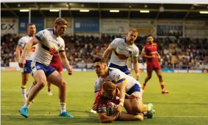  ?? ?? Catalans Dragons’ Adam Keighran scores the opening try. Photograph: Richard Sellers/PA