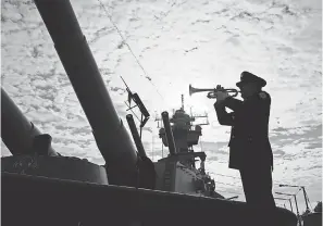  ?? MATT ROURKE/AP ?? Greg Murphy plays the Navy Hymn last year during a ceremony commemorat­ing the 75th anniversar­y of the attack on Pearl Harbor, on board the battleship New Jersey Museum and Memorial in Camden, N.J.