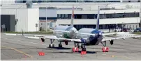  ??  ?? Two undelivere­d Airbus A320neos are parked at the Toulouse Airport in France. — Reuters