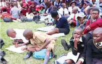  ?? ?? Schoolchil­dren take down notes as career resource persons presented on the academic requiremen­ts of various profession­s during a career guidance, grooming, etiquette and stay in school programme organised by First Lady Dr Auxillia Mnangagwa in Mashonalan­d East on Monday