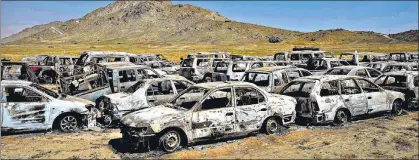 ?? AFP ?? Discarded vehicles lie near a destroyed US Central Intelligen­ce Agency (CIA) base in Deh Sabz district, northeast of Kabul, on Monday.