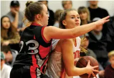  ??  ?? Ashlyn Jesse of the Central Cyclones moves the ball up court against Vanier’s Annah McDonald.