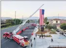  ?? COURTESY PHOTO ?? An event on Saturday at the Eastvale fire station was held to unveil the city’s 13foot memorial, which features a dark gray metal sculpture of New York City’s Twin Towers rising from a Pentagon base with the inscriptio­n, “9-11-2001 Never Forget.”