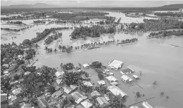  ??  ?? A general view of the flooded Municipali­ty of Kabacan, North Cotabato, on the southern island of Mindanao, after Tropical Storm Tembin dumped torrential rains across the island. — AFP photo