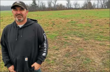  ?? PAUL POST — PPOST@DIGITALFIR­STMEDIA.COM ?? Koval Brothers Dairy co-owner Chris Koval says some fields have been slow to green up this spring. In addition, wet and cold conditions have delayed planting, which will put extra pressure on farmers to get a lot done in a hurry when the weather...