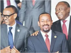  ??  ?? Rwanda’s President Paul Kagame, Ethiopia Prime Minister Abiy Ahmed and Ramaphosa pose for a family photo on the sidelines of a AU summit in Addis Ababa. — AFP photo